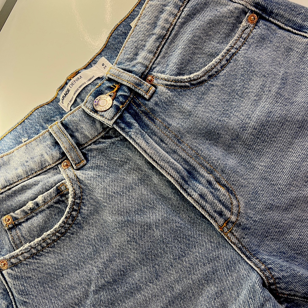 size 0/24inch jeans, high rise, light blue with shades of grayish